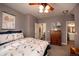 Main bedroom with ceiling fan and access to bathroom at 12711 Colorado Blvd # 912, Thornton, CO 80241