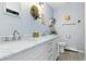 Updated bathroom with double vanity and marble countertops at 11827 Brook Rd, Golden, CO 80403