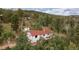 Aerial view of a house in a wooded area at 11827 Brook Rd, Golden, CO 80403