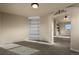 Bedroom area featuring built-in shelving and an archway leading to another room at 315 Venison Creek Dr, Monument, CO 80132