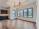 Open dining area with hardwood floors and large windows overlooking backyard at 14560 N Navajo Ct, Broomfield, CO 80023