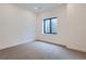 Simple bedroom with grey carpet and a window with a view at 14560 N Navajo Ct, Broomfield, CO 80023