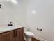 Powder room with a modern wood vanity and white quartz countertop at 14560 N Navajo Ct, Broomfield, CO 80023