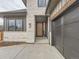 Front entry and garage of craftsman style home at 14560 N Navajo Ct, Broomfield, CO 80023