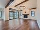 Spacious living room with hardwood floors, fireplace and large windows at 14560 N Navajo Ct, Broomfield, CO 80023