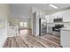 Modern kitchen with stainless steel appliances and light gray cabinets at 6140 E 121St Dr, Brighton, CO 80602