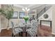 Elegant dining area with hardwood floors and stylish chairs at 12653 Fisher Dr, Englewood, CO 80112