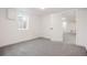 Spacious basement bedroom with grey carpet and large closet at 7956 Joan Dr, Denver, CO 80221