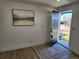 Bright entryway with wood-look floors and view to backyard at 7956 Joan Dr, Denver, CO 80221