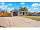 Newly painted ranch home with driveway and attached garage at 7956 Joan Dr, Denver, CO 80221
