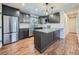 Modern kitchen with dark cabinetry and stainless steel appliances at 1876 S Nucla St, Aurora, CO 80017