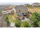 Home's backyard features a patio, hot tub, and landscaping at 547 Cinnabar Ln, Castle Rock, CO 80108