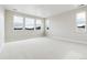 Spacious bedroom with light carpet and multiple windows at 5566 Hickory Oaks Trl, Castle Rock, CO 80104