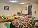 Finished basement bedroom with two beds and colorful rug at 18929 Kent Pl, Aurora, CO 80013