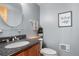 Clean basement bathroom with dark vanity and updated fixtures at 26196 Rea Ave, Conifer, CO 80433