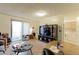 Bright living room with open concept kitchen and laundry area at 8047 Wolff St # F, Westminster, CO 80031