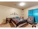 Spacious bedroom with a comfortable bed and seating area at 8047 Wolff St # F, Westminster, CO 80031