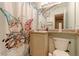 Charming bathroom with whimsical shower curtain and sink at 8047 Wolff St # F, Westminster, CO 80031