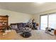 Cozy living room features a comfy couch and access to a patio at 8047 Wolff St # F, Westminster, CO 80031
