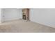 Finished basement with a stone fireplace and carpeted floor at 4455 S Delaware St, Englewood, CO 80110