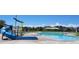 Resort-style pool with a waterslide and a playground at 4823 Astor Pl, Brighton, CO 80601