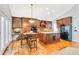 Modern kitchen with granite island, custom cabinetry, and stainless steel appliances at 17043 Hastings Ave, Parker, CO 80134