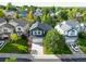 An aerial view of a two-story house with a driveway and landscaping at 17043 Hastings Ave, Parker, CO 80134