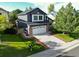 Two story house with driveway, and a basketball hoop at 17043 Hastings Ave, Parker, CO 80134