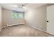 Well-lit bedroom featuring neutral walls and carpet at 937 N Clarkson St # 206, Denver, CO 80218