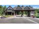 Gated entrance to the community, showcasing a charming stone structure at 6178 Oxford Peak Ln, Castle Rock, CO 80108