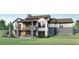 Home's back elevation showcasing a deck, patio, and stairs leading down to the yard at 6178 Oxford Peak Ln, Castle Rock, CO 80108
