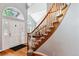 Two-story entryway with a curved staircase and hardwood floors at 5627 S Idalia St, Centennial, CO 80015