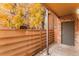 Private patio with storage unit and wooden fence at 2255 S Buckley Rd # 102, Aurora, CO 80013