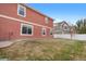 Side yard with grassy area and fence at 5552 Flanders Way, Denver, CO 80249