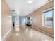Bright living room with hardwood floors, and access to the kitchen and backyard at 5552 Flanders Way, Denver, CO 80249