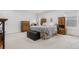 Spacious bedroom with a dresser and large bed at 5552 Flanders Way, Denver, CO 80249