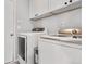 Bright laundry room with modern washer and dryer at 5552 Flanders Way, Denver, CO 80249