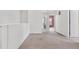 Hallway with carpet and access to bathroom and bedrooms at 5552 Flanders Way, Denver, CO 80249