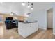 Kitchen island with seating overlooking the living room area at 5552 Flanders Way, Denver, CO 80249