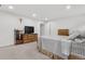 Bright bedroom with wood dresser and window at 5552 Flanders Way, Denver, CO 80249