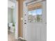 Entryway with a view of a toilet and a door leading outside at 5552 Flanders Way, Denver, CO 80249