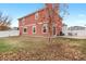 Spacious backyard with grassy area and tree at 5552 Flanders Way, Denver, CO 80249