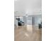 Open living room with hardwood floors, a view of the kitchen and a sliding door leading outside at 5552 Flanders Way, Denver, CO 80249