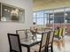 Modern dining area with glass table and city views at 1700 Bassett St # 1013, Denver, CO 80202