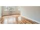 Bright living room with hardwood floors and large windows at 969 S Pearl St # 204, Denver, CO 80209