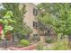 Apartment building with mature trees and well-maintained landscaping at 969 S Pearl St # 204, Denver, CO 80209