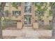 Apartment building exterior with entrance and landscaping at 969 S Pearl St # 204, Denver, CO 80209