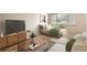 Studio apartment living room with sofa, bed, and wood floors at 969 S Pearl St # 204, Denver, CO 80209
