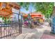 Outdoor patio seating area with umbrellas and bistro tables at 969 S Pearl St # 204, Denver, CO 80209
