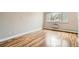 Well-lit bedroom with hardwood floors and a large window at 969 S Pearl St # 204, Denver, CO 80209